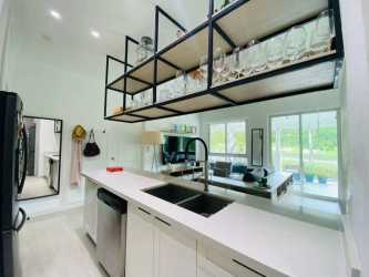 Kitchen with modern cabinetry and countertop in Bijao Rodman Tower Panama