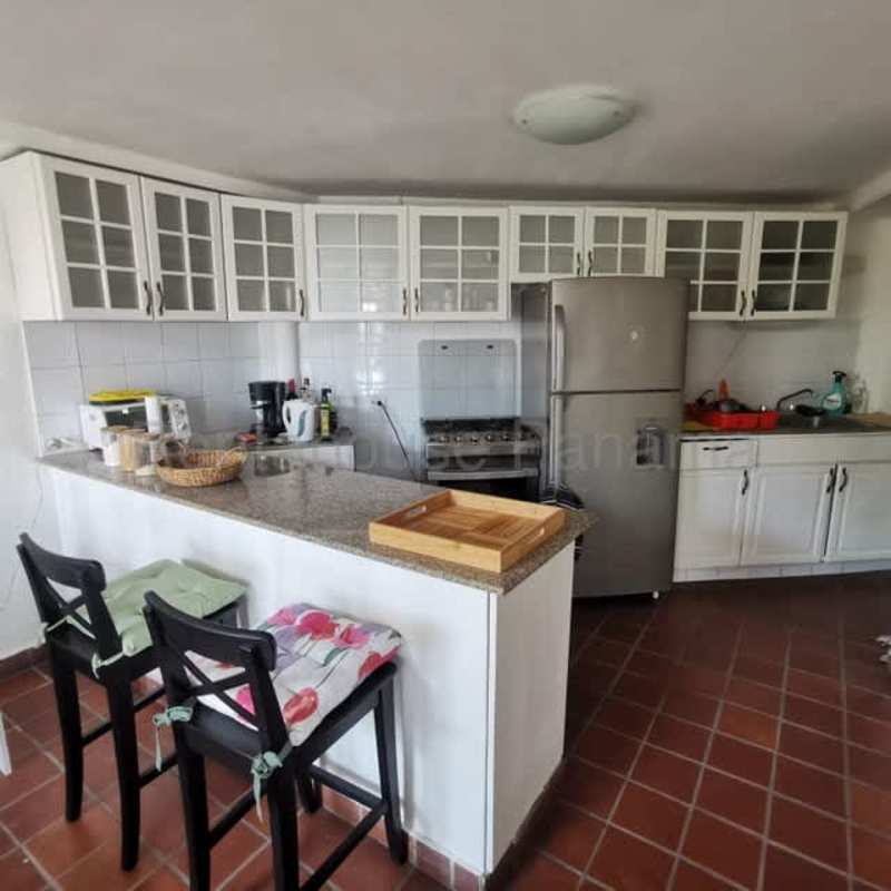 Ornate balcony overlooks Panama City bay and skyline Casco Viejo apartment