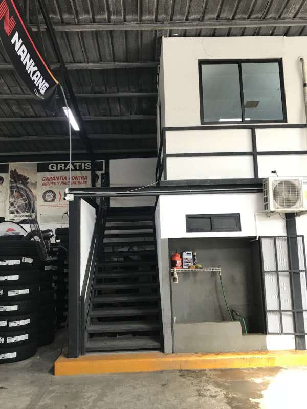 Interior with loft office and metal stairs in commercial warehouse Parque Lefevre Panama