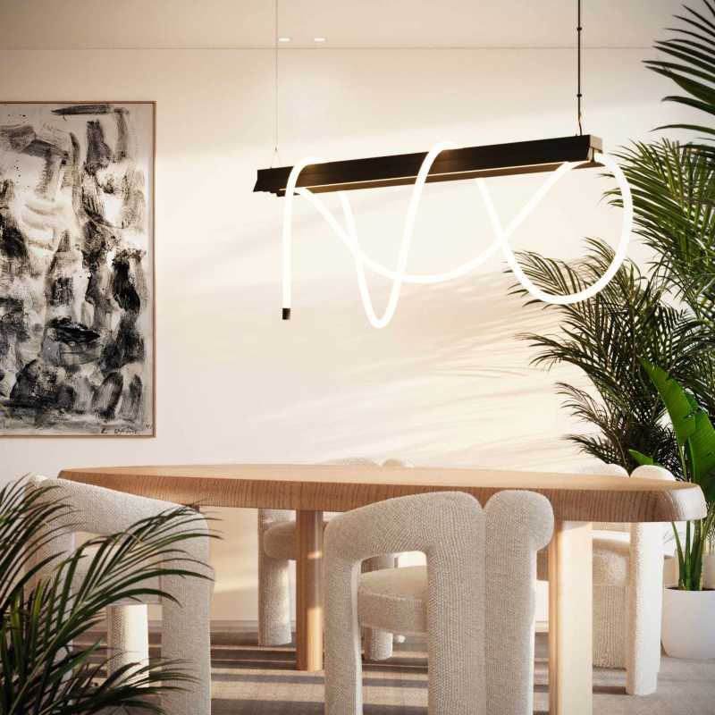 Contemporary dining room with abstract light fixture, wall art, and wood table in PH Nautilus Panama