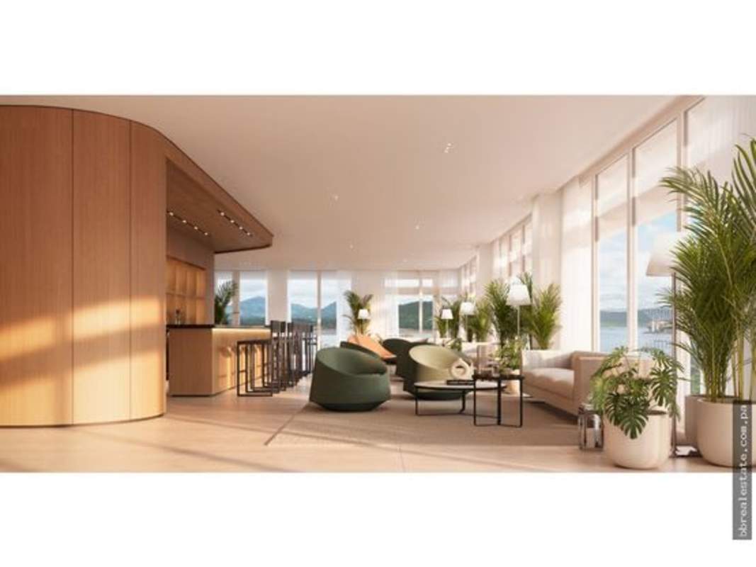 Bright lounge with panoramic windows, wood decor, bar area and indoor plants at PH Nautilus Panama