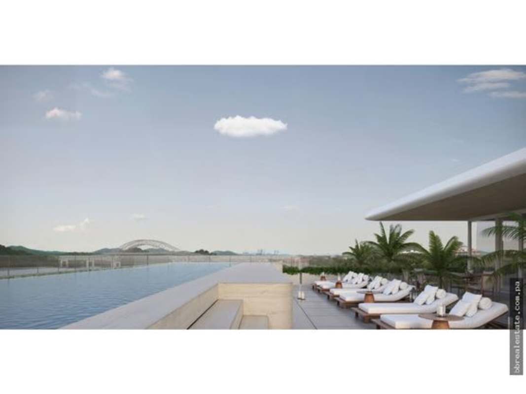 Rooftop infinity pool with skyline and canal view on sunny day at PH Nautilus Panama