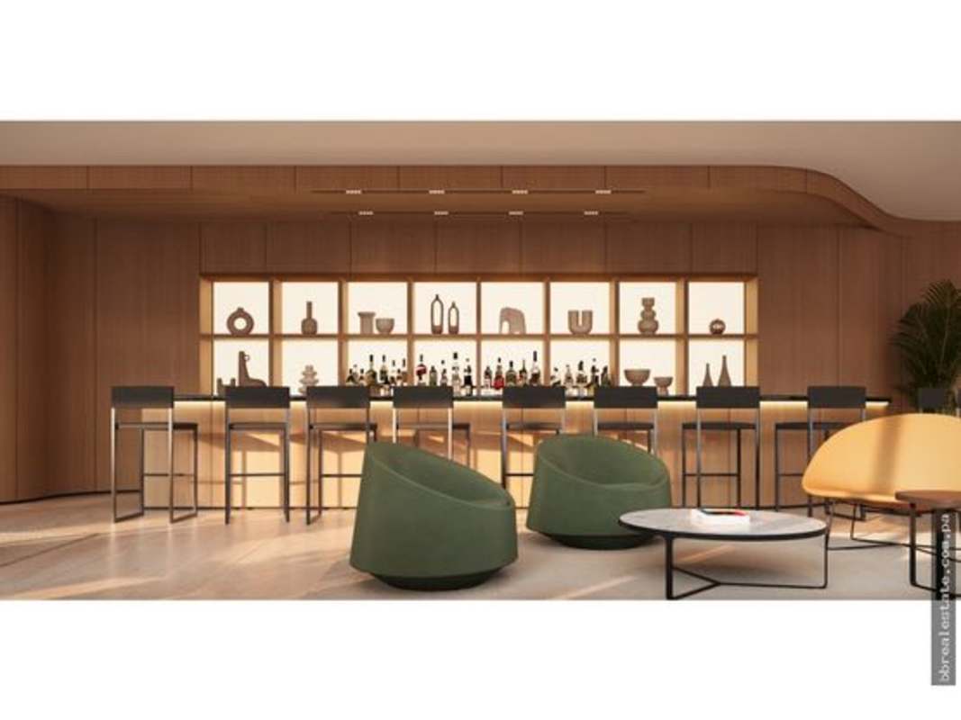 Modern multi-story building with ocean views and palm landscaping at PH Nautilus Panama