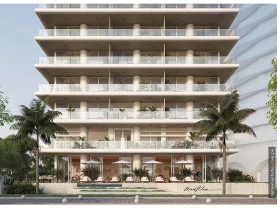 Chic lounge bar with backlit wood shelving and seating at PH Nautilus Panama