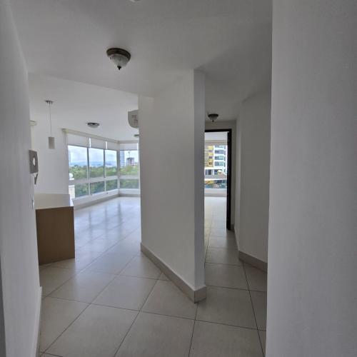 Bright bedroom featuring city views in furnished PH Bali apartment Costa del Este Panama