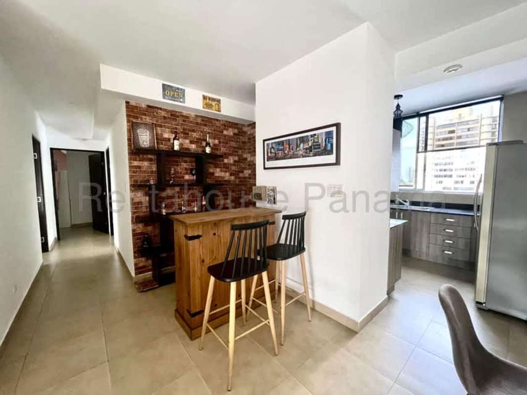 Kitchen with granite countertop, wooden cabinets, appliances in PH San Francisco JG apartment for rent Panama