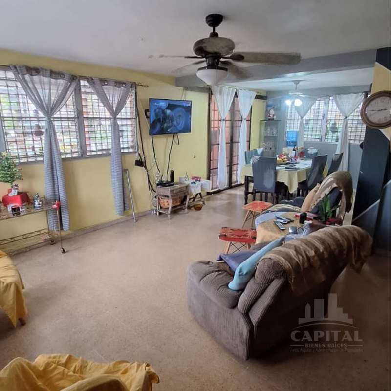 Living area spacious bright windows curtain ceiling fan Betania corner house Panama