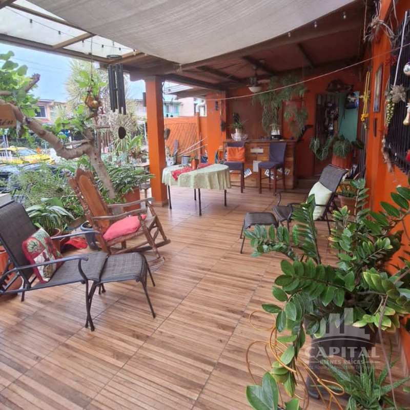Covered rustic terrace wooden floor bar seating corner house Betania Panama
