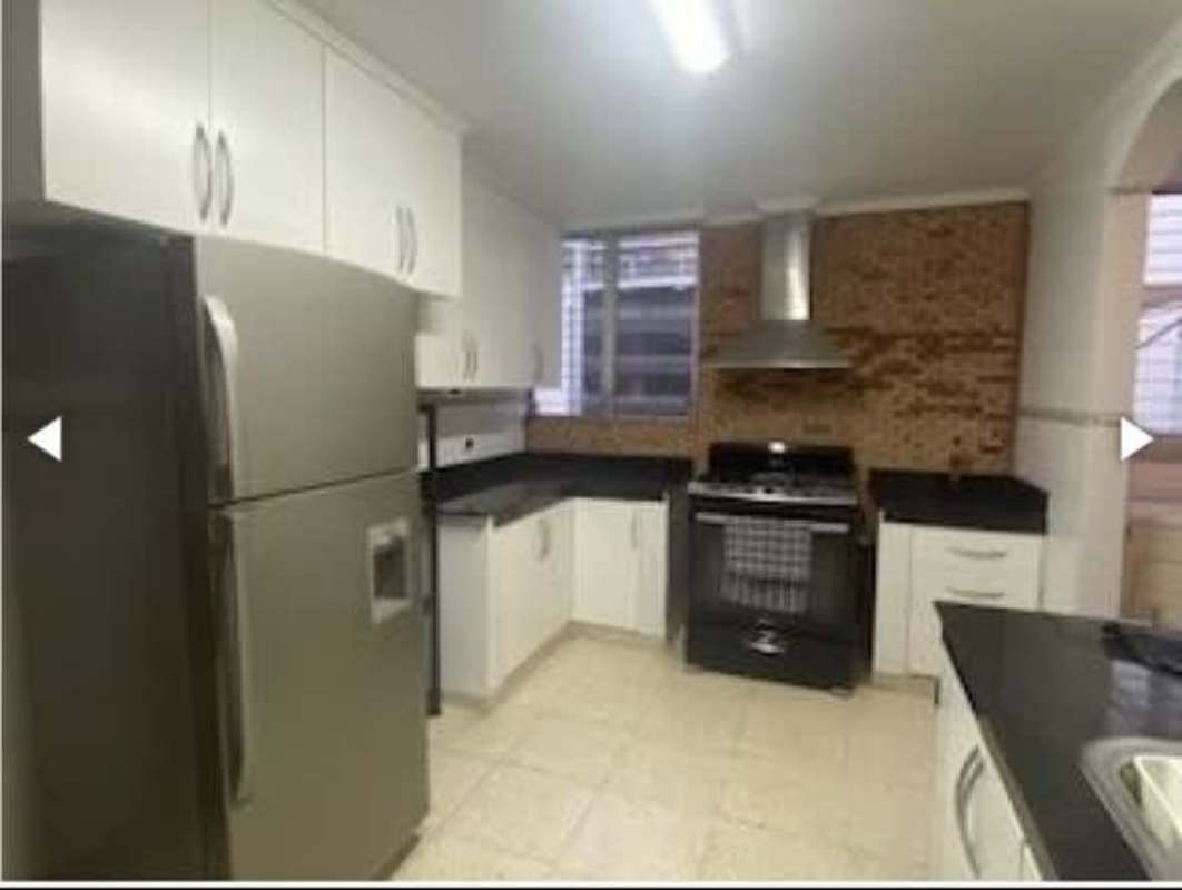 Contemporary kitchen with granite countertops and stainless steel refrigerator in PH Las Marquesas San Francisco Panama