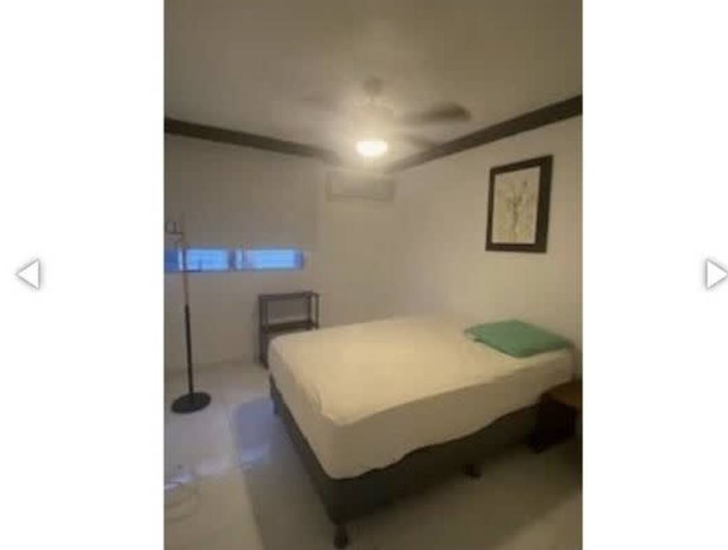 Bedroom with split AC, ceiling fan, and modern decor in PH Las Marquesas San Francisco Panama