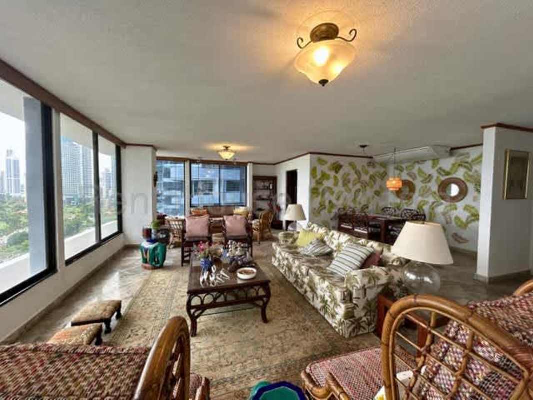 Spacious kitchen with granite countertops, wood cabinetry and city views at PH La Gaviota penthouse Panama