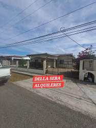 Exterior facade with gated driveway and covered carport in La Fontana David Panama