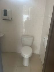 Simple tiled bathroom with toilet commercial lease Costa Verde La Chorrera Panama
