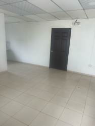 Empty white-walled interior room with tiled floor commercial space Costa Verde Plaza Panama