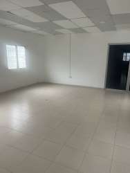 Large open-plan interior with tiled floor drop ceiling commercial rental Costa Verde Plaza Panama