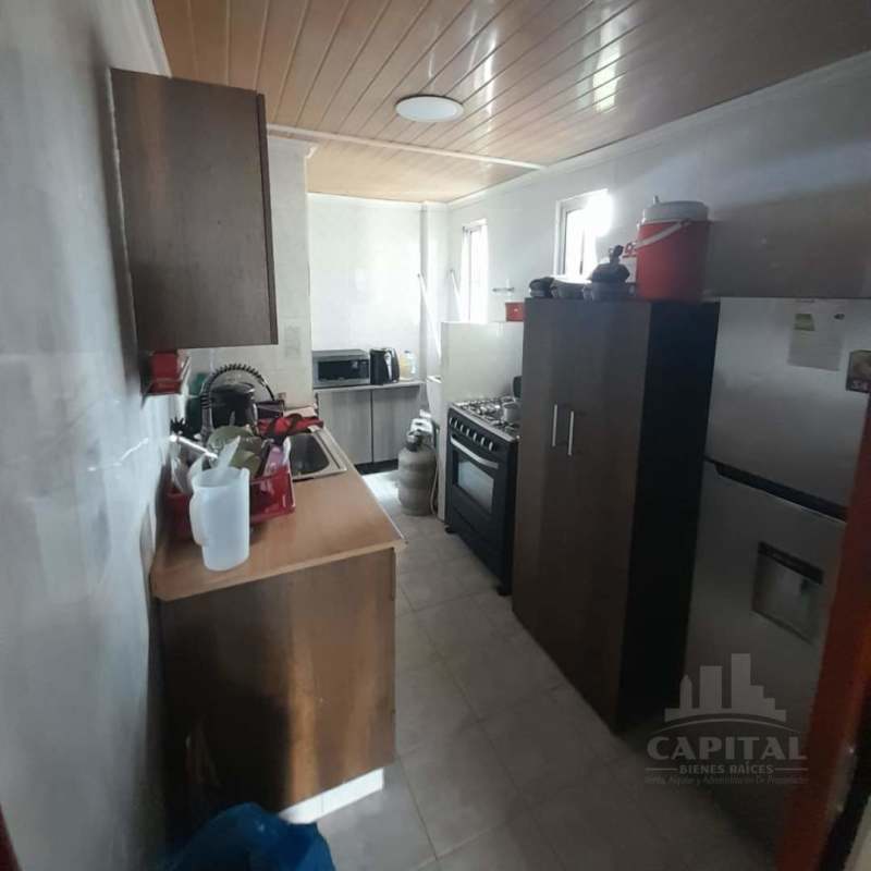 Functional small kitchen with wood cabinets gas stove PH Terrano for sale in Panama