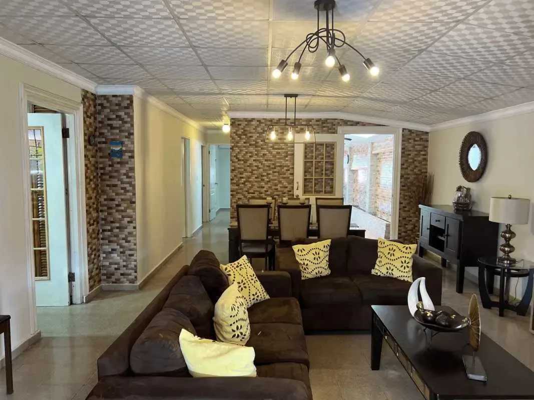 Living room with brown sofa set and decorative details Villa Lucre Tierras Altas Panama