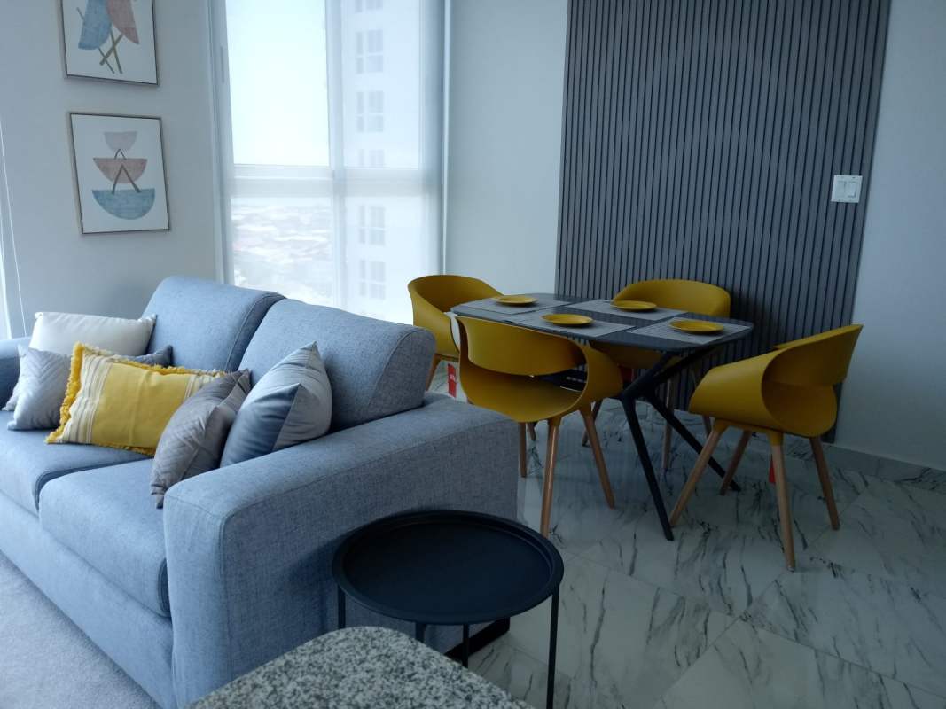 High-rise condominium pool deck with sun loungers and skyline views at PH BICSA