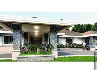 Covered terrace overlooking large garden in mountain home Boquete Panama