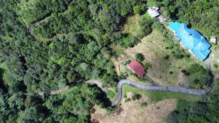 Secluded estate with blue roof on Cerro Tigre overlooking forest El Valle Panama