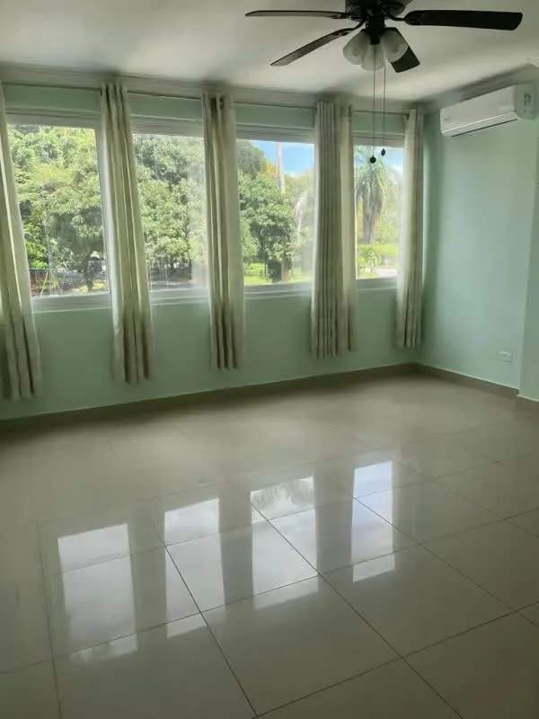 Panoramic balcony with metal railing and green garden view in PH Albrook Gardens Panama City