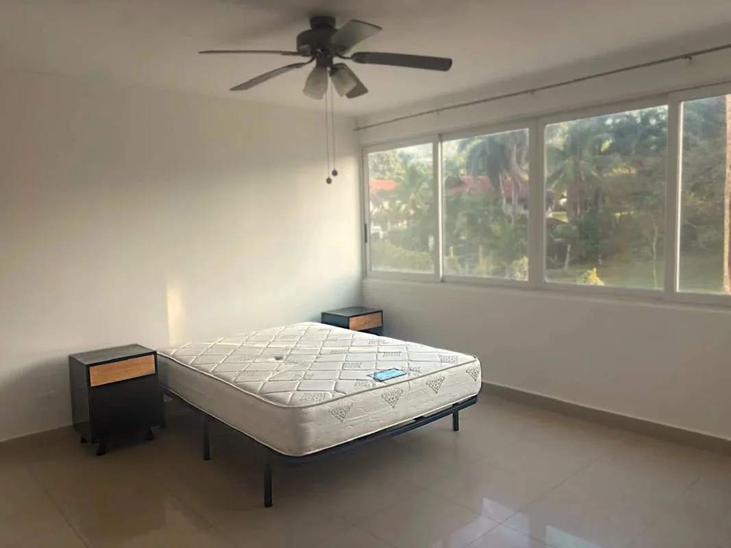 Furnished master bedroom with ceiling fan split AC tile floors in PH Albrook Gardens Clayton Panama