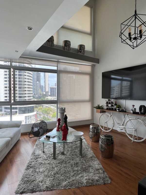Loft mezzanine bedroom with wood floors, built-in closet, AC, partial ocean view in Bayfront Tower Panama