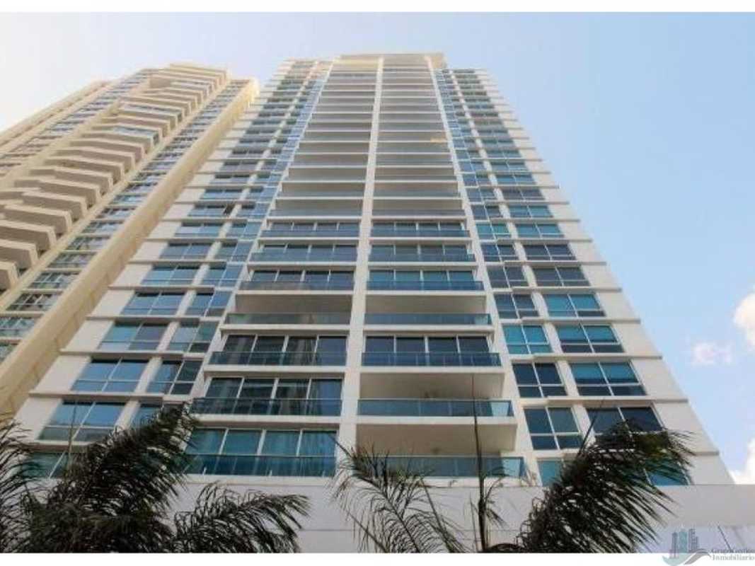 Skyline view from rooftop infinity pool at Bayfront Tower with lounge chairs Panama City