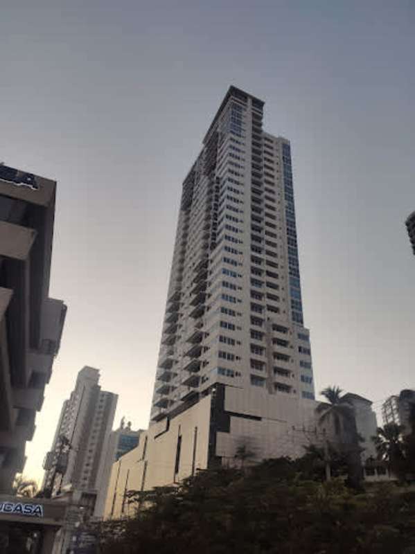Interior lobby with marble floor and modern elevators at PH Signature Point Panama City