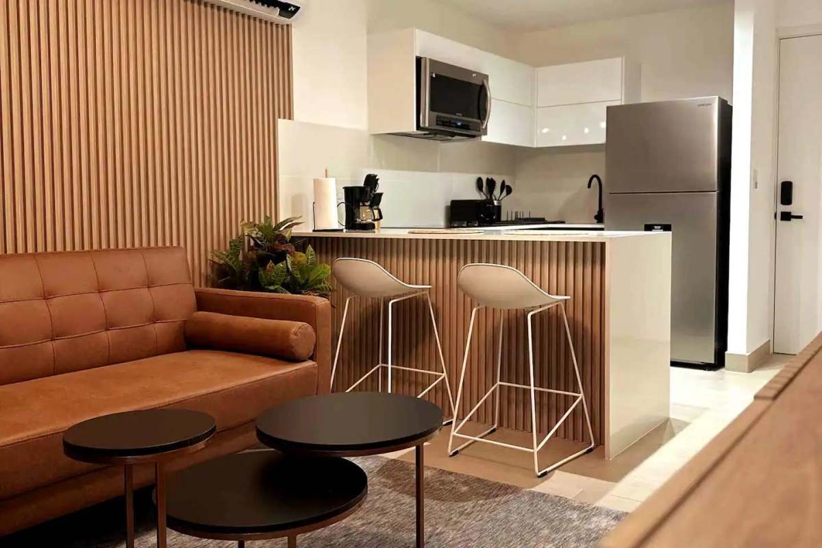 Furnished bedroom with balcony, built-in closet, and AC in smart apartment PH Living 73 Panama City