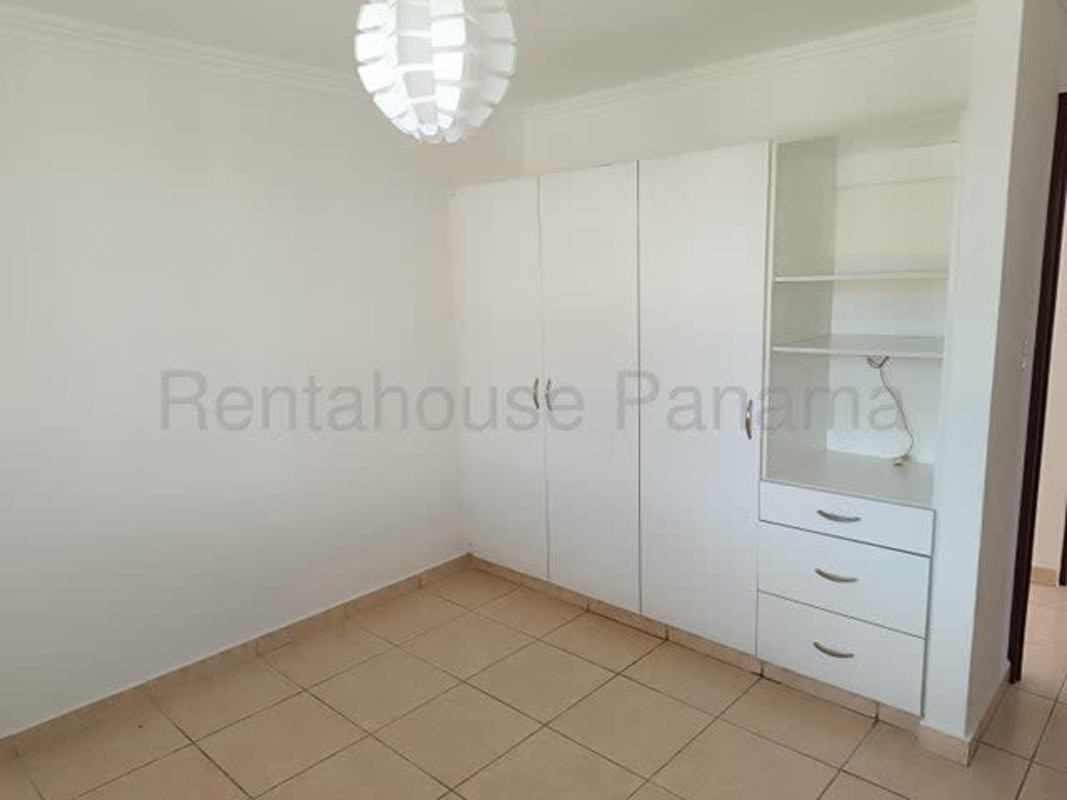 Covered terrace patio area in backyard Brisas del Golf house for sale Panama