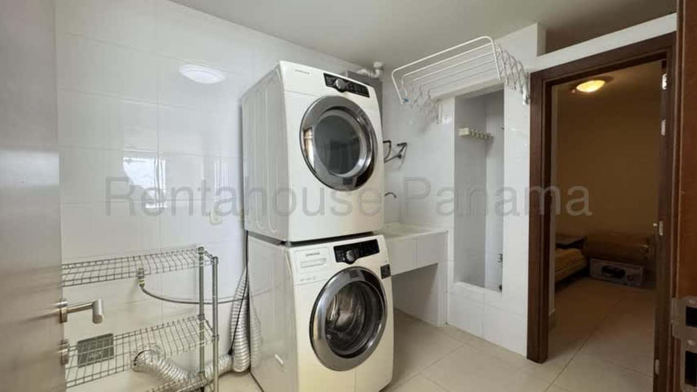 Contemporary kitchen in luxury apartment at Santa Maria with marble floors and stone countertops
