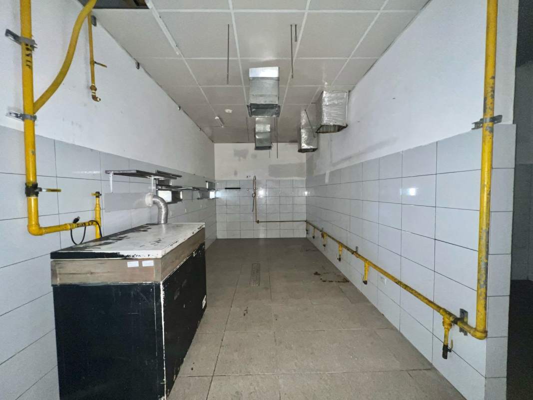 Commercial kitchen area with tiled walls and gas line installation perfect for restaurant in San Francisco Panama City