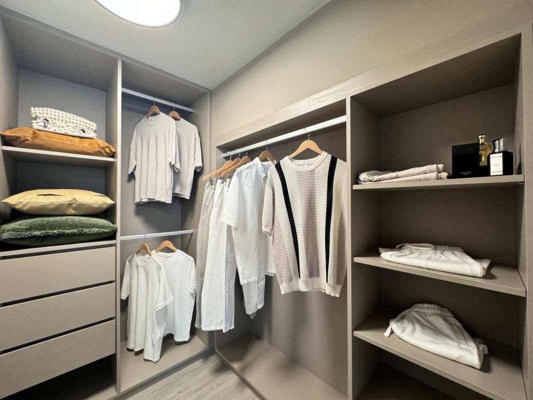 Cozy bedroom with large window and city skyline views at PH Dovle Coco del Mar Panama City