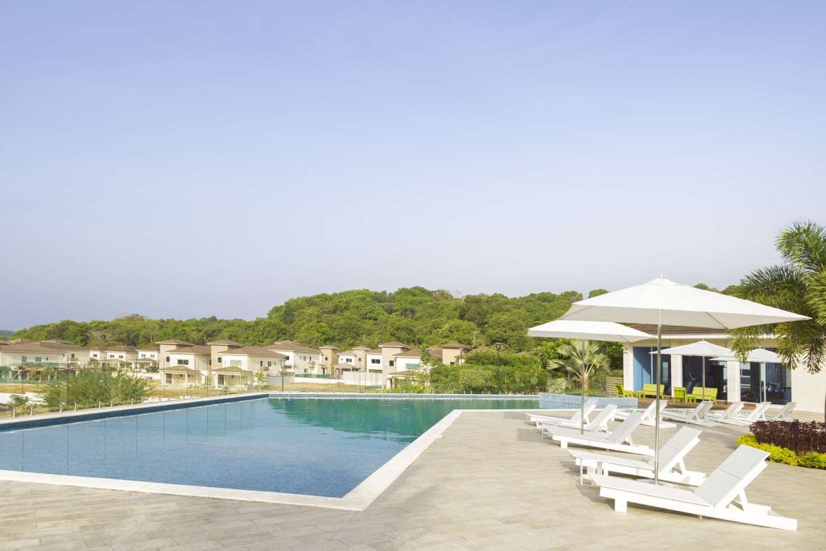 Infinity pool surrounded by landscaped gardens Altos del Parque Panama