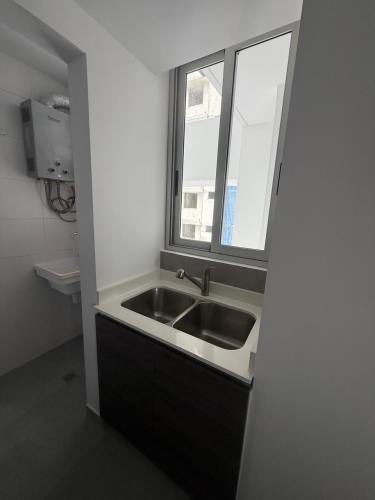 Bright living area with large windows and balcony at PH Torres de Castilla Carrasquilla Panama City