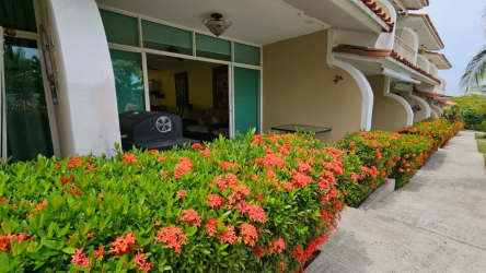 Private balcony overlooking gardens at Malibu Beach Residences Playa Malibú Panama