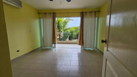 Large community swimming pool with gazebo surrounded by garden at Malibu Beach