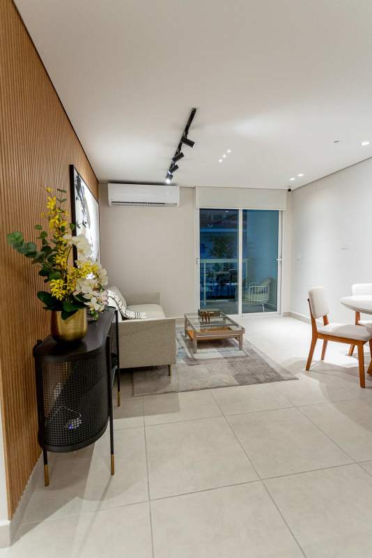 Kitchen opens to living room with neutral decor at PH Mi Condado apartment Condado del Rey