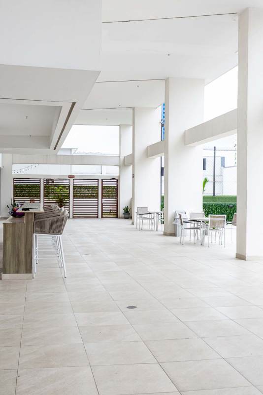 Outdoor social terrace with seating and bar counter at Mi Condado Panama