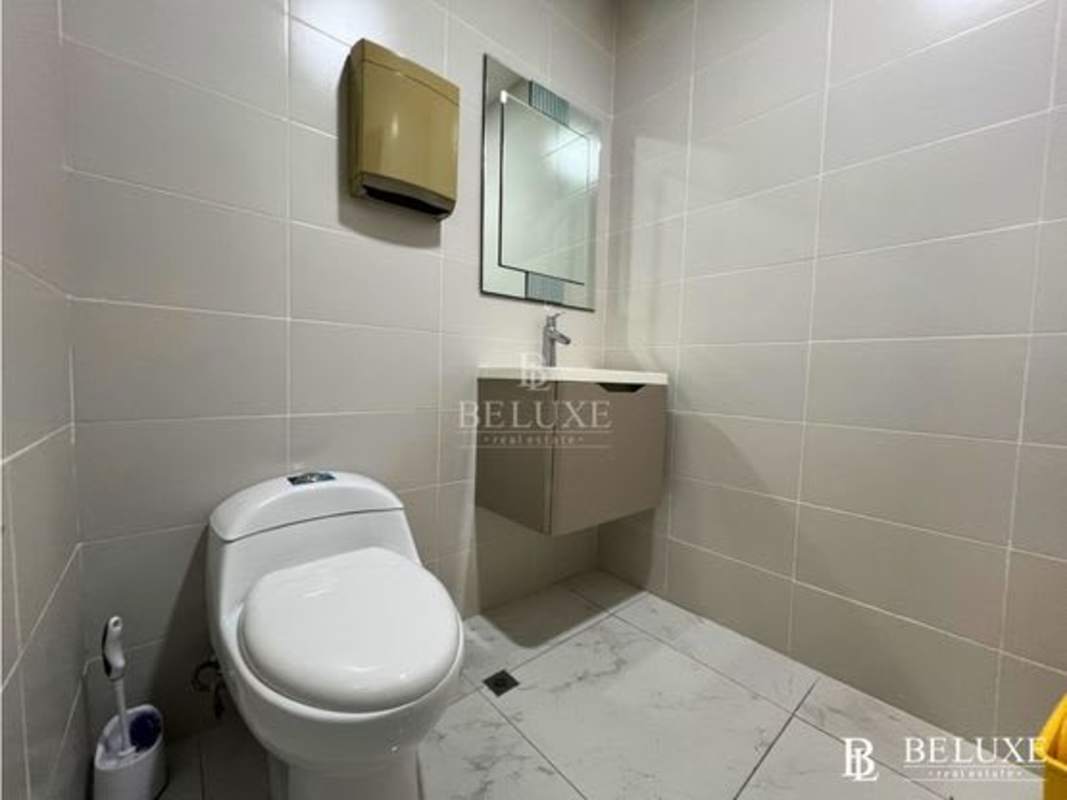 Private glass-enclosed office space in RBS Tower overlooking Panama City skyline