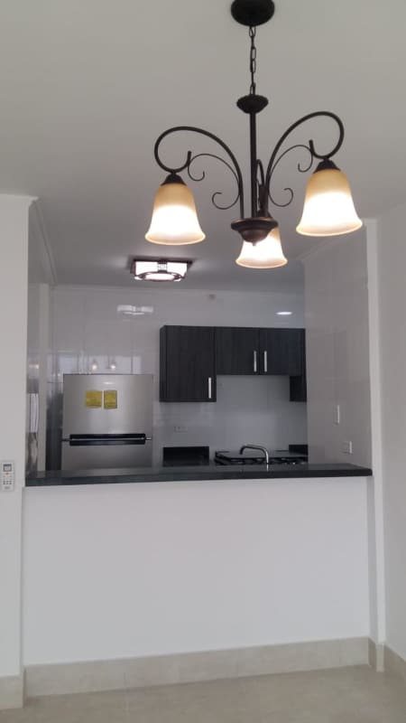 Kitchen featuring washer/dryer space granite countertops in PH Sky Point Panama
