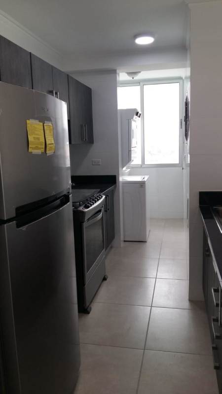 Lobby with marble floors, teal chairs, art decor PH Sky Point Tower Tumba Muerto Panama