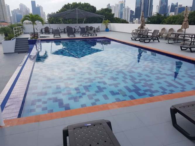 Kitchen with granite countertops, stove, cabinets in PH Torre Capri San Francisco Panama