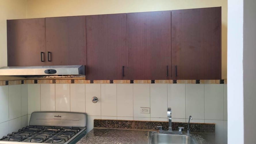 Modern gym with equipment and pool views PH Torre Capri Panama City