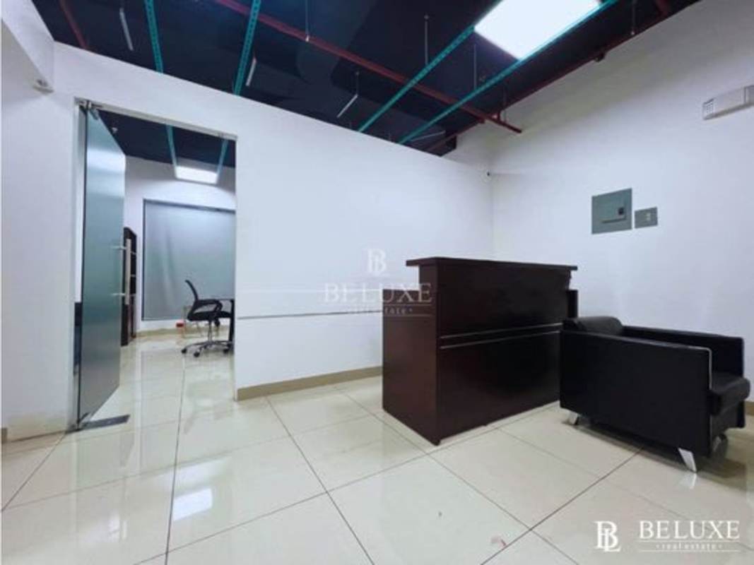 Reception area with modern design and exposed ceiling in luxury office for rent in RBS Tower Panama City