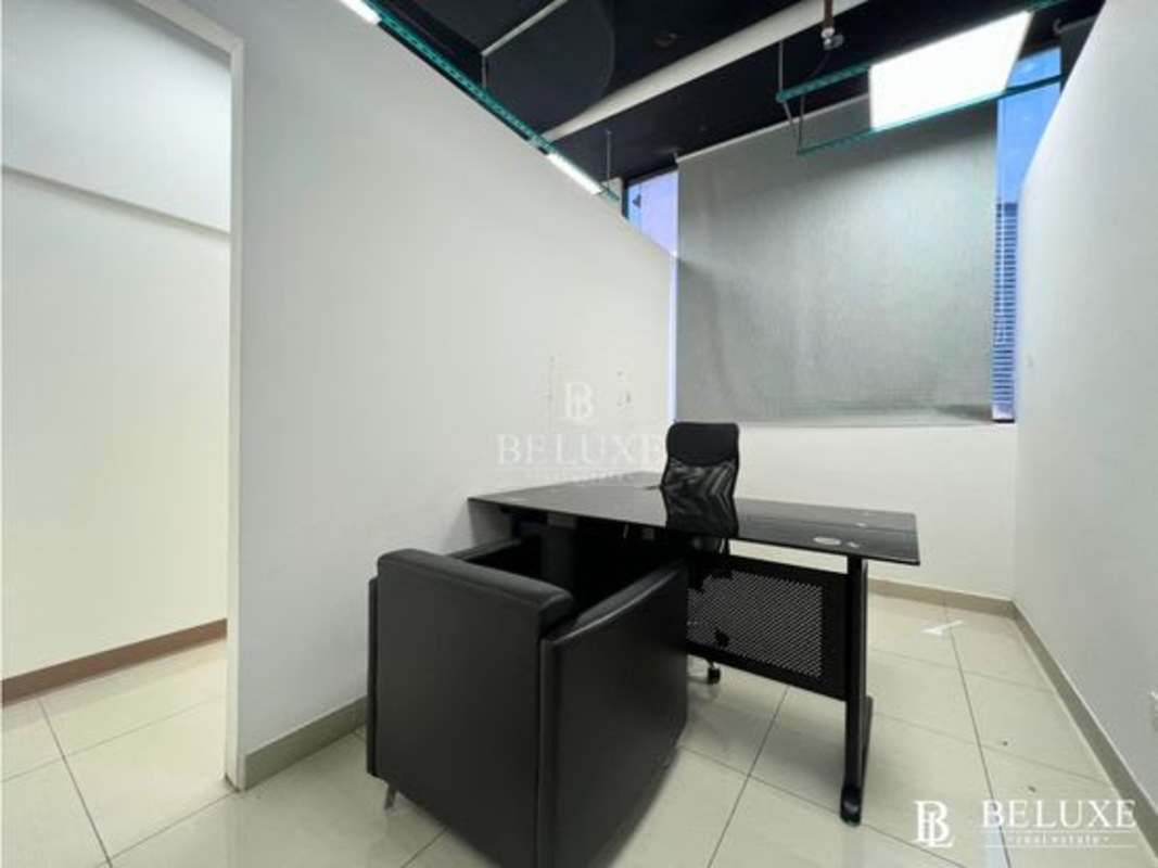 Modern conference room with glass enclosure and ceramic tile in RBS Tower office building Panama City