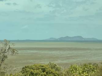 Distant mountain backdrop behind large development lot Playa Leona Panama