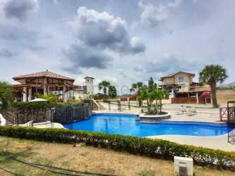 Large swimming pool with gazebo palm trees San Carlos Panama gated community