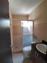 Open living area with vaulted ceiling sliding doors and tile floor beach house Panama